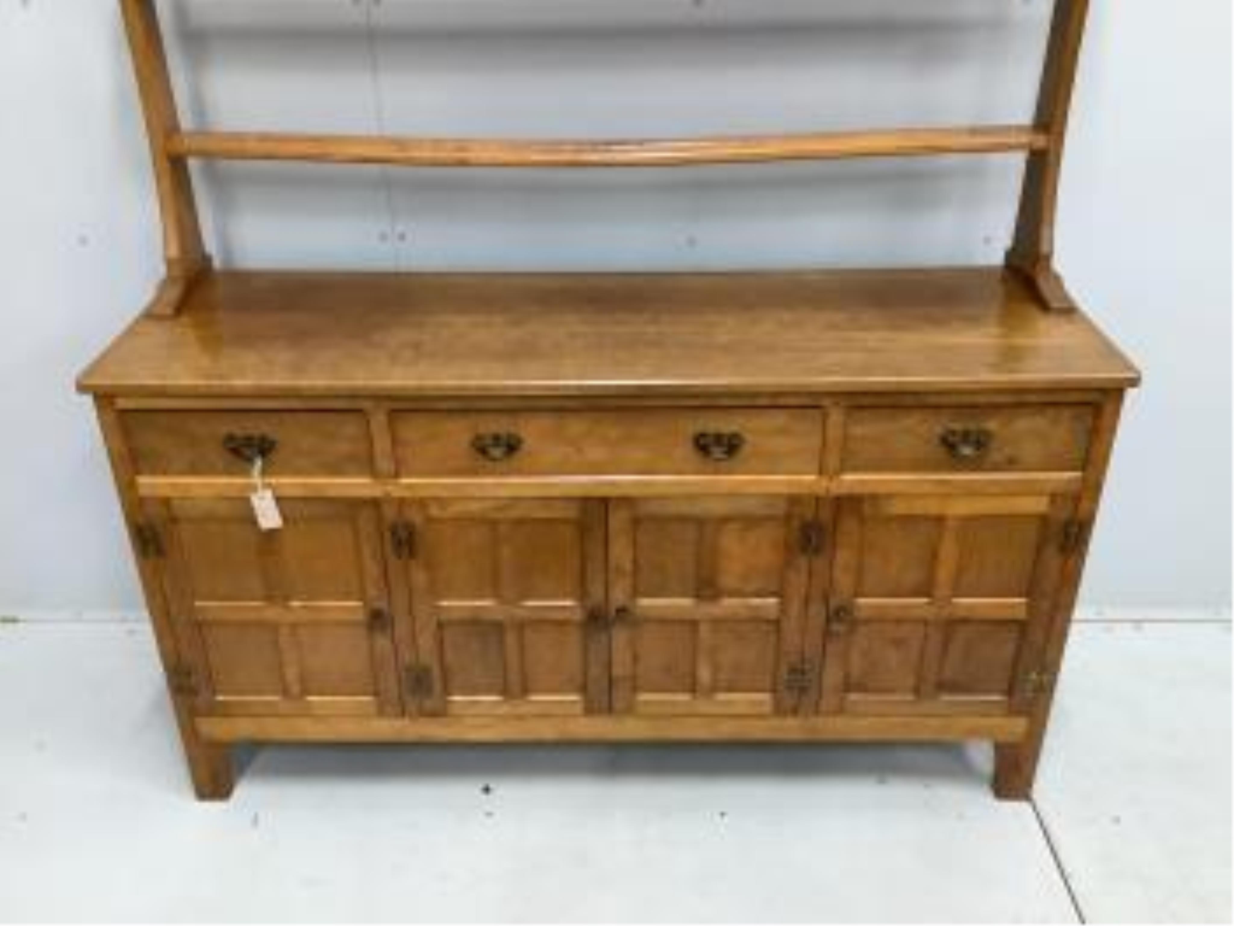 Alan Grainger 'Acorn Man', a mid century adzed oak dresser with open plate rack, width 160cm, depth 48cm, height 170cm. Condition - good